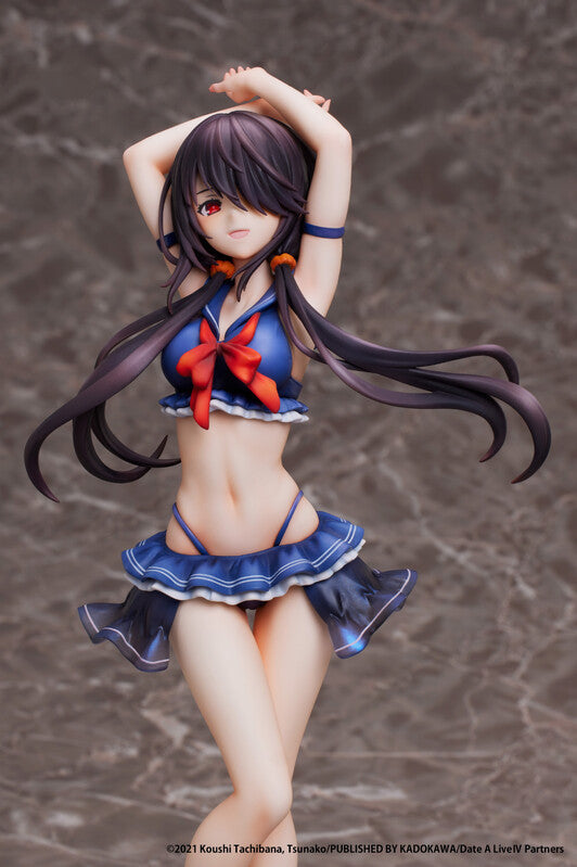 Left side dynamic pose of Date A Live IV Kurumi Tokisaki 1/7 scale swimsuit figure, arm raised with flowing black hair, red ribbon bikini top, blue frilled skirt and high heels