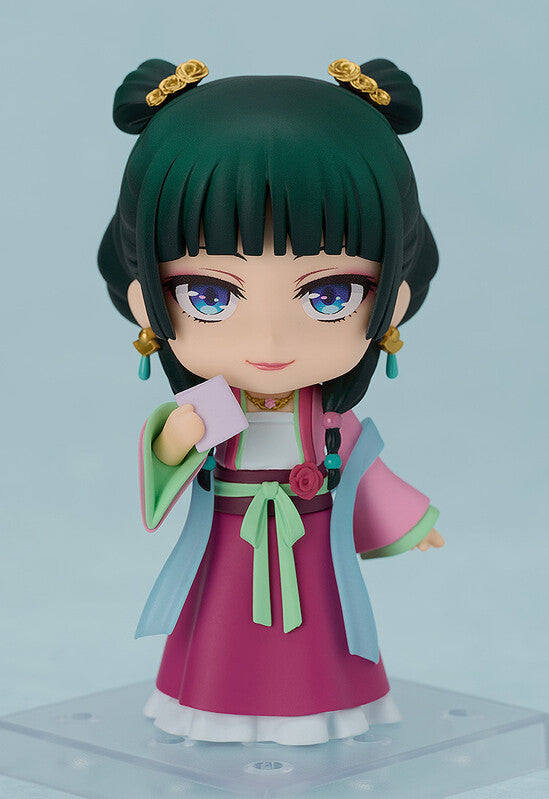 Good Smile Nendoroid Maomao Garden Party Version right side profile dark green twin buns blue eyes pink ruqun hanfu dress green sash on display stand The Apothecary Diaries Kusuriya no Hitorigoto chibi figure GSC2070