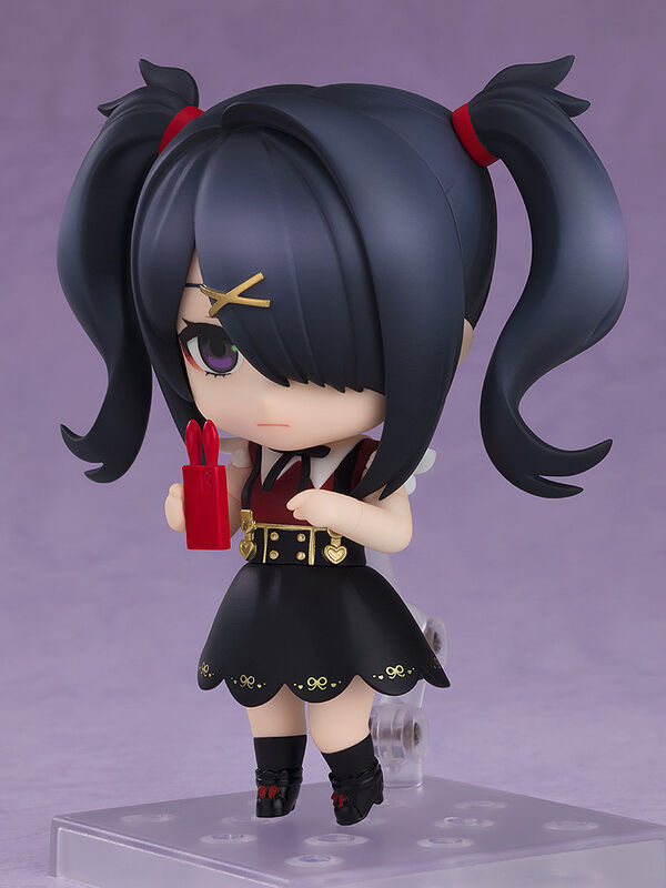 Good Smile Pop Up Parade Kizuna Akari figure three-quarter view on clear base, holding red item black twin tails red ribbons cross pupils angry expression sailor uniform black skirt thigh-highs detailed pose chibi anime merch